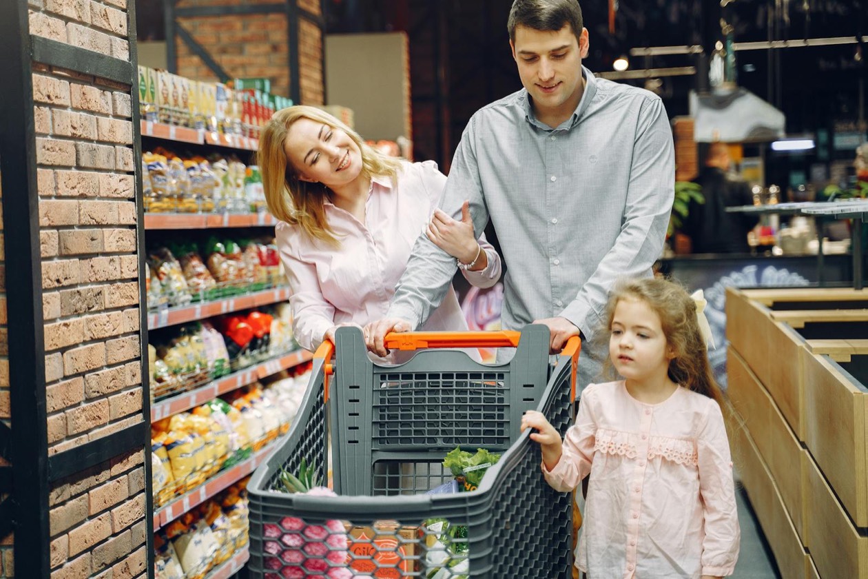 Shopper pushing a cart in a supermarket &mdash; the silent majority of light buyers driving brand growth