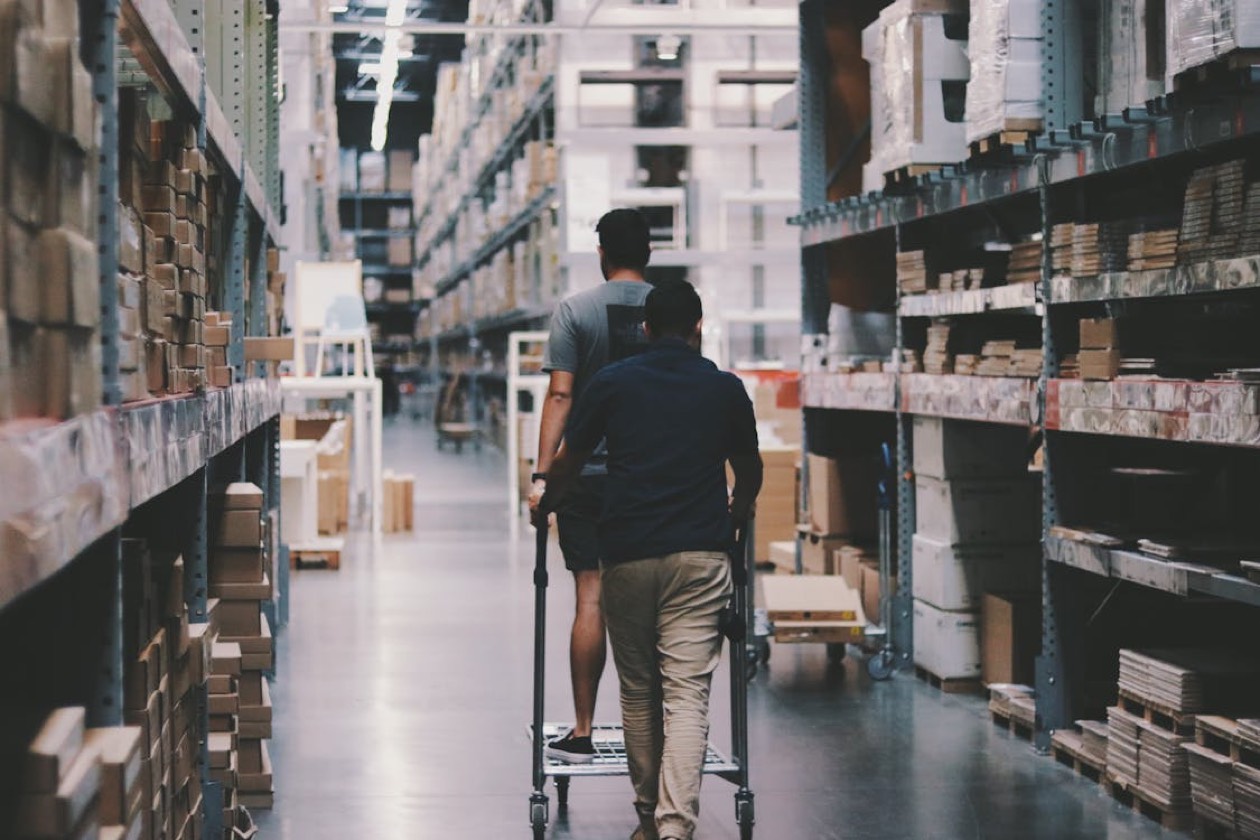 Logistics warehouse with pallets — inventory planning and FMCG retail sell-through